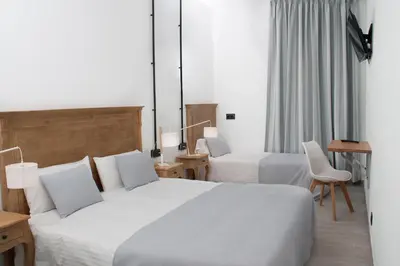Cama o camas de una habitación en Hostal Portofino