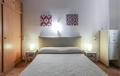 Cama o camas de una habitación en Cozy Apartment In Malgrat De Mar