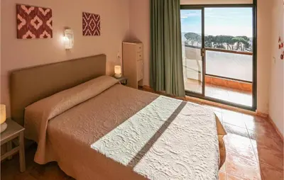 Cama o camas de una habitación en Cozy Apartment In Malgrat De Mar