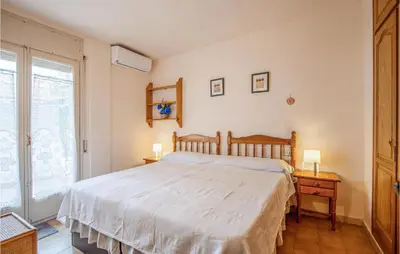 Cama o camas de una habitación en Beach Front Apartment