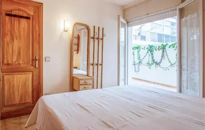 Cama o camas de una habitación en Beach Front Apartment