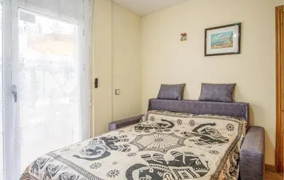 Cama o camas de una habitación en Beach Front Apartment