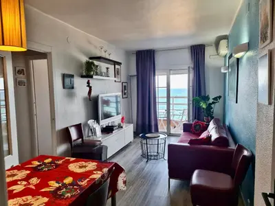 Una televisión o centro de entretenimiento en Apartment in front of the Beach