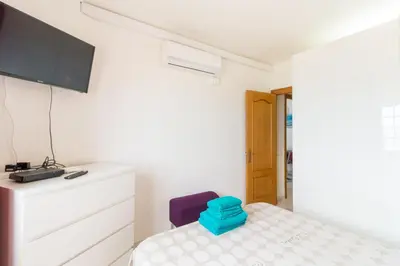 Cama o camas de una habitación en Apartment in front of the Beach