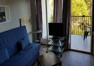 Una televisión o centro de entretenimiento en Cala Llevadó 2 – Vistas, Piscina y Cerca del Mar