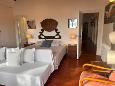 Cama o camas de una habitación en Casa única con jardín a 45 metros de la playa. BE