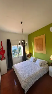 Cama o camas de una habitación en Apartamento con jardín a 11 metros de la playa. CG.