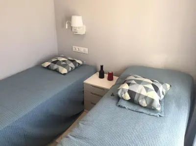 Cama o camas de una habitación en Nuevo Luminoso Apartamento Catalina a 80 metros de la playa para 4 personas