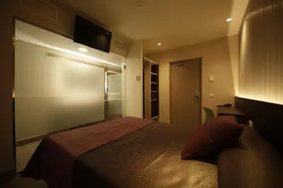 Una televisión o centro de entretenimiento en Hotel Papi Blau