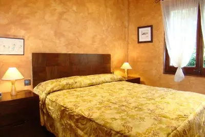 Cama o camas de una habitación en Club Villamar - Tana
