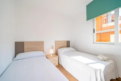 Cama o camas de una habitación en HomeHolidaysRentals Moana