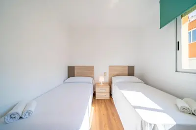 Cama o camas de una habitación en HomeHolidaysRentals Moana