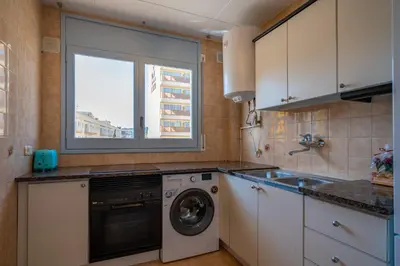 Una cocina o zona de cocina en HomeHolidaysRentals Elodie