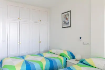 Cama o camas de una habitación en Hauzify I Apartaments SuperBeach