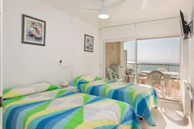 Cama o camas de una habitación en Hauzify I Apartaments SuperBeach