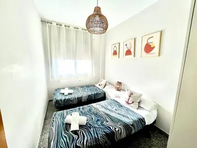 Cama o camas de una habitación en BEACH&POOL, Boutique Apartament with free parking, full equipped in Fenals Beach