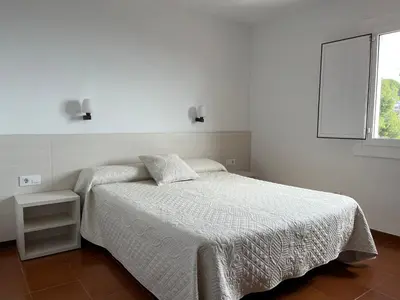 Cama o camas de una habitación en Private Apartments Cala Canyelles