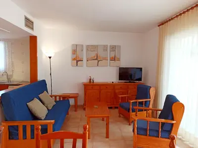 Una televisión o centro de entretenimiento en Village Golf Beach