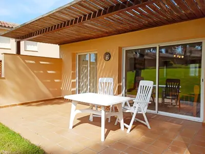 Un patio o zona al aire libre en Village Golf Beach