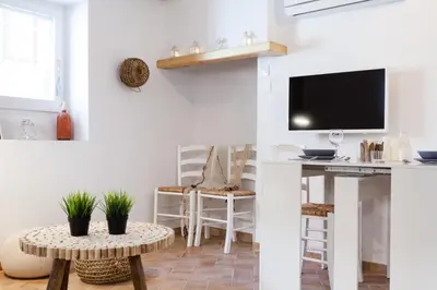 Una televisión o centro de entretenimiento en L'Havanera Boutique Home