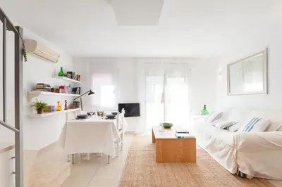 Una televisión o centro de entretenimiento en Marina Boutique Duplex