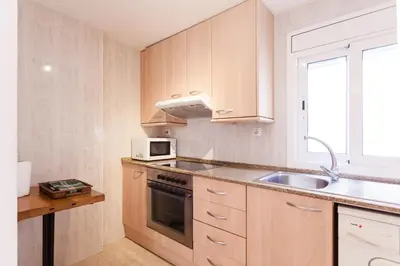 Una cocina o zona de cocina en Patio Budget Apartment 12