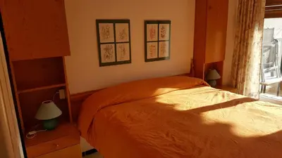 Cama o camas de una habitación en Apart 2 habit vistas playa y montaña lift parking