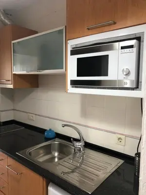 Una cocina o zona de cocina en Espectacular apartamento con piscina en Calella de Palafrugell
