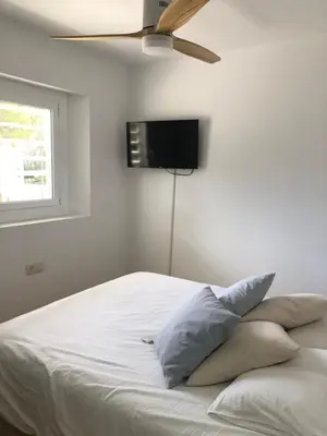 Cama o camas de una habitación en Espectacular apartamento con piscina en Calella de Palafrugell