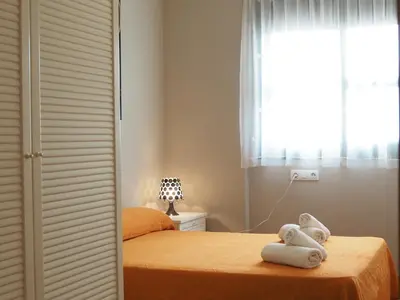 Cama o camas de una habitación en NINFA Apartamento con balcón ideal familias con vistas al mar