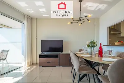 Una televisión o centro de entretenimiento en Palamós BeachFront Apartment