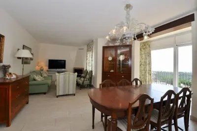 Una televisión o centro de entretenimiento en VILLA MIRIAM