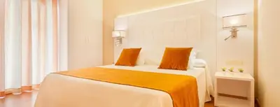 Cama o camas de una habitación en Apartamentos Beverly