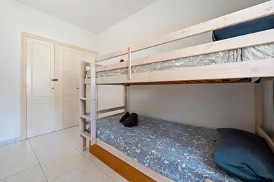 Cama o camas de una habitación en Hauzify I Apartament Orquídies