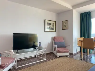 Una televisión o centro de entretenimiento en Mediterranean apartment in Lloret de Mar next to the Sea