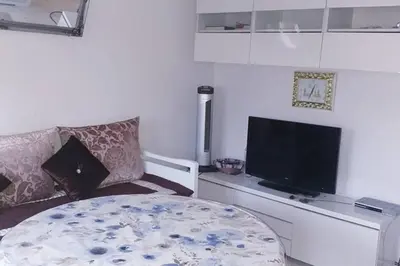 Una televisión o centro de entretenimiento en Apartamento vacaciones