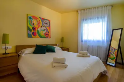 Cama o camas de una habitación en Devesa Park Apartment with Private Parking
