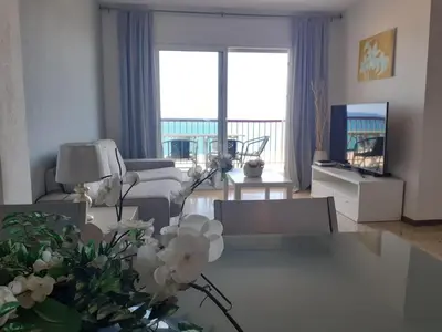 Zona de estar de Suitur apartamento primera linea mar vistas playa