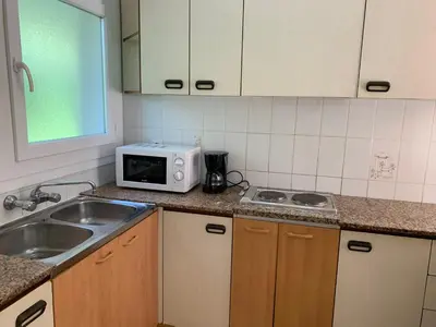 Una cocina o zona de cocina en Eva Aparthotel