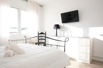 Cama o camas de una habitación en Hauzify I Center S'Agaró