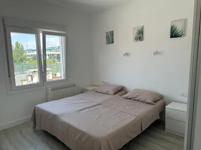 Cama o camas de una habitación en White Apartment