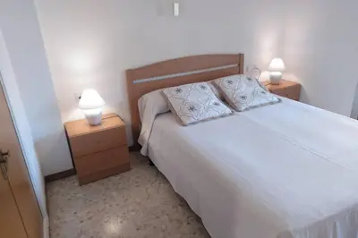 Cama o camas de una habitación en Apartament Lloret de Mar Fenals 100m beach