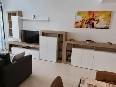 Una televisión o centro de entretenimiento en Piso Andrea