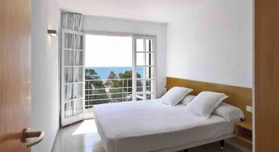 Cama o camas de una habitación en Villa Reymar - diseño y vistas al mar