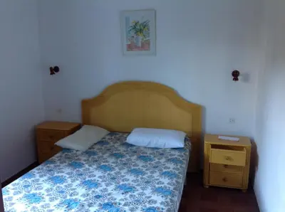 Cama o camas de una habitación en Apartament Turístic Alhambra