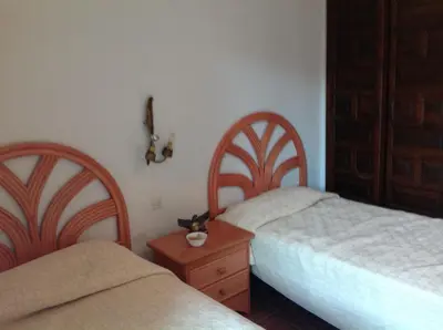 Cama o camas de una habitación en Apartament Turístic Alhambra