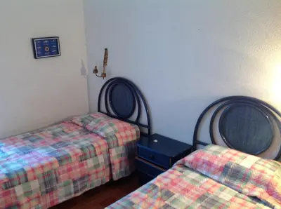 Cama o camas de una habitación en Apartament Turístic Alhambra