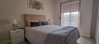 Cama o camas de una habitación en Apartamentos Neptuno
