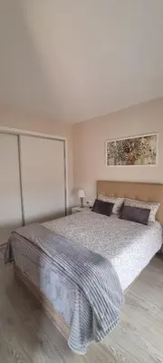 Cama o camas de una habitación en Apartamentos Neptuno