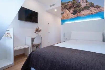 Cama o camas de una habitación en Hotel BESTPRICE Girona